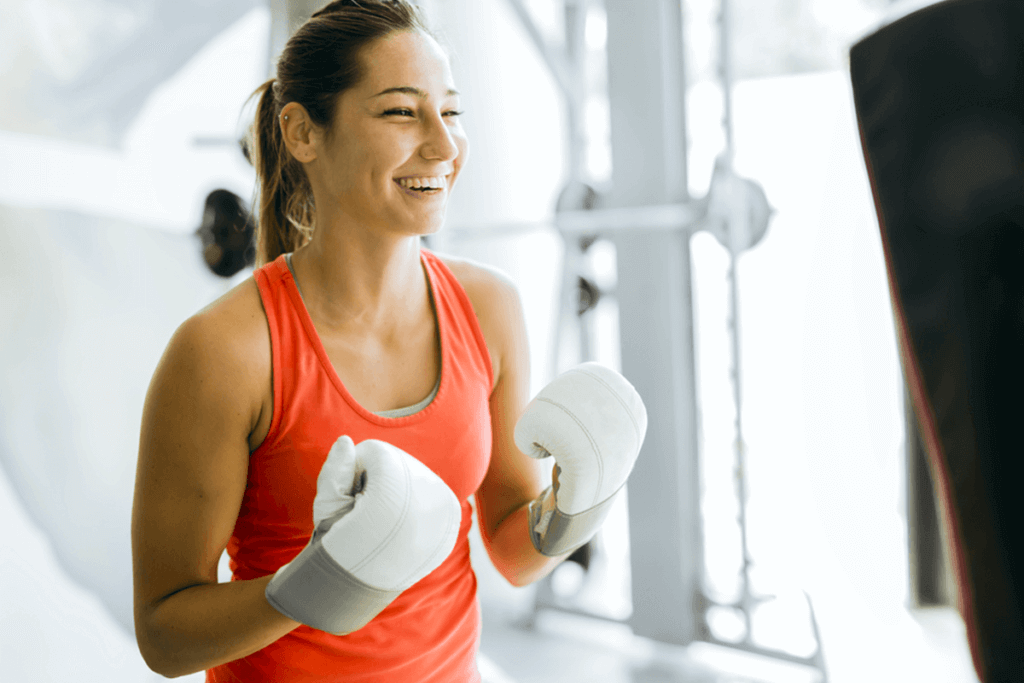 woman with two white boxing gloves on