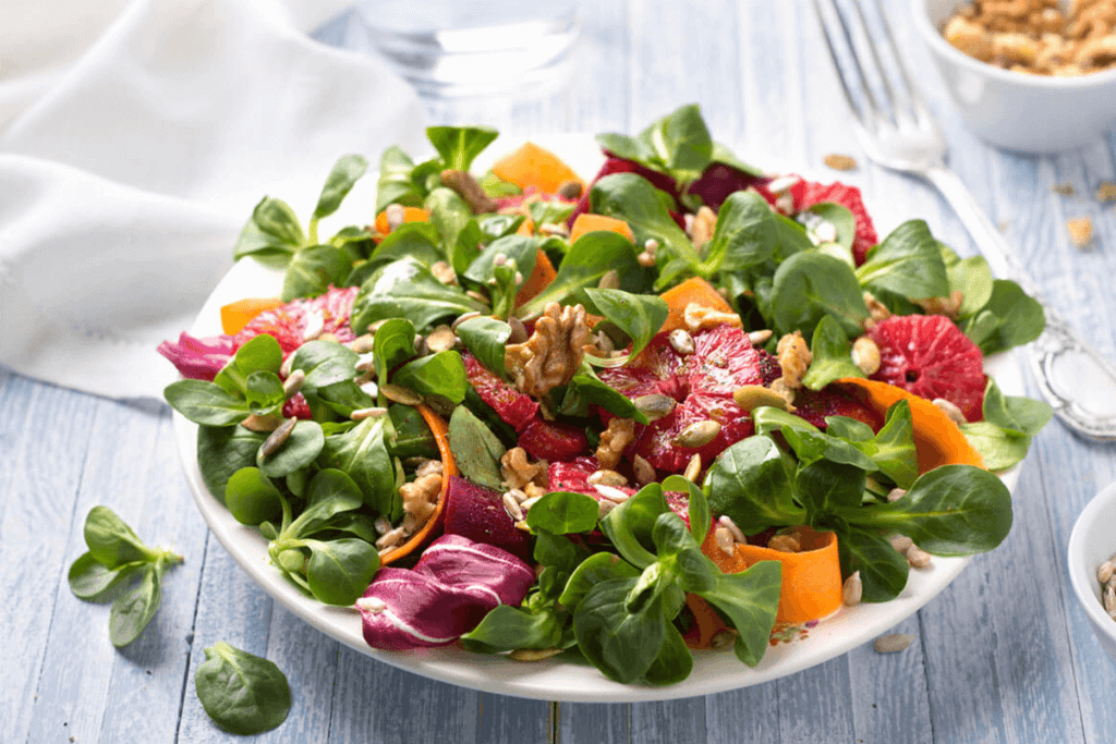 Bright salad bowl on a light-colored table