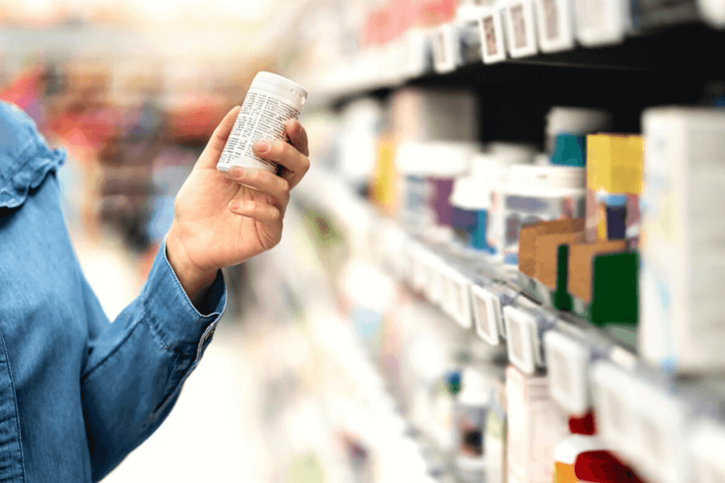 close up of hand with a supplement bottle
