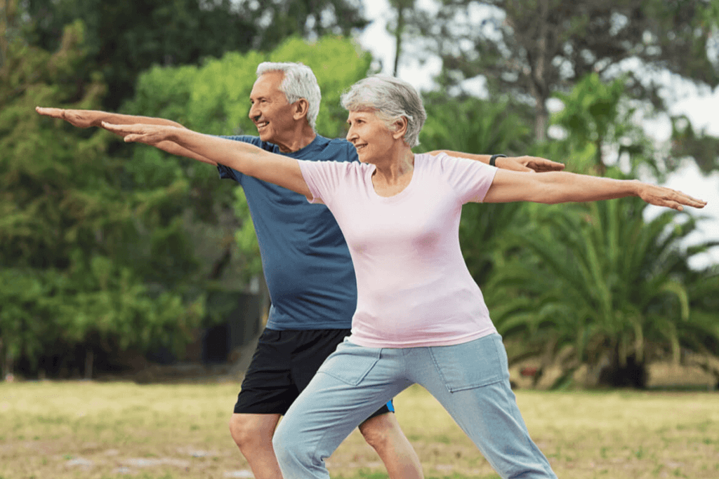 man and woman doing yoga outdoors