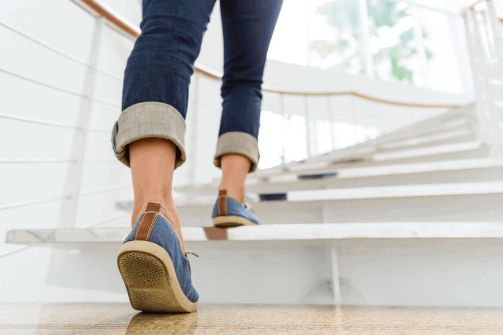 close up of someone's feet walking up the stairs
