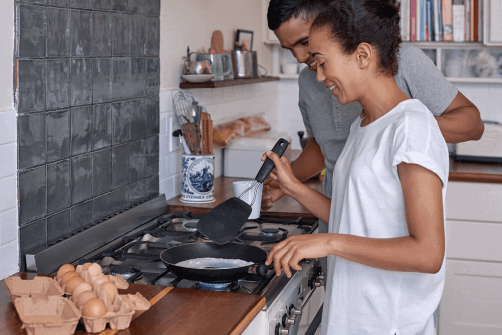 couple in the kitchen cooking