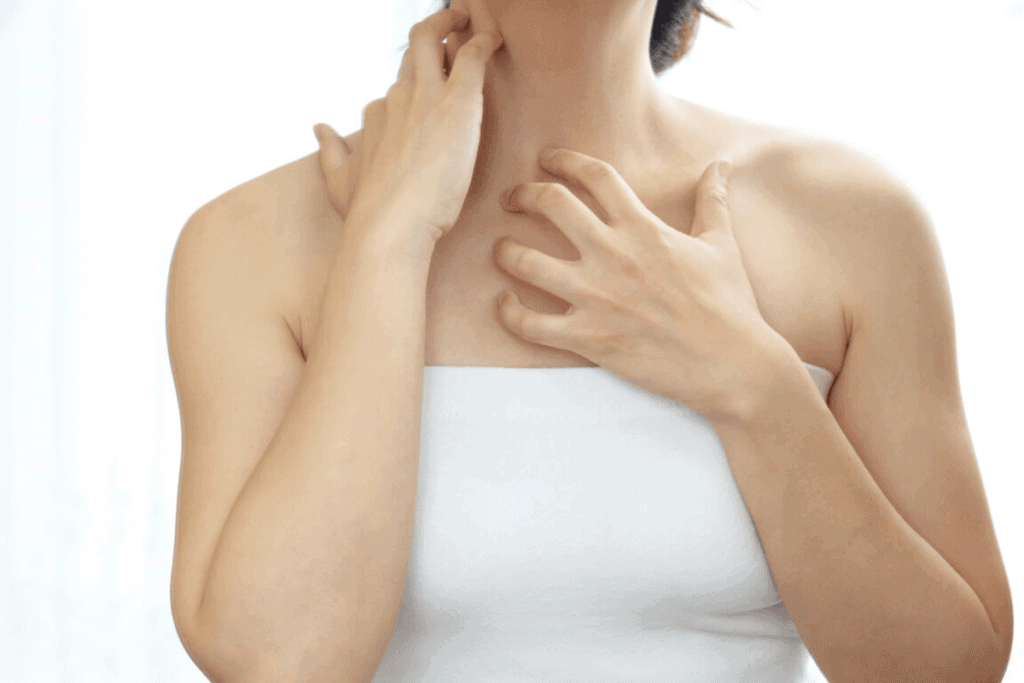 close up of person scratching their neck