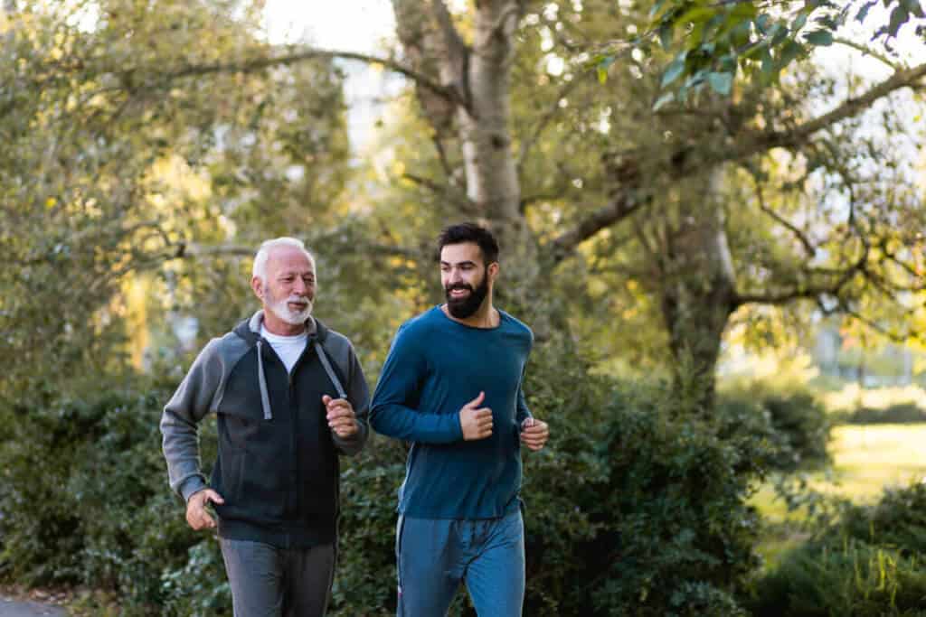 two men running outdoors together