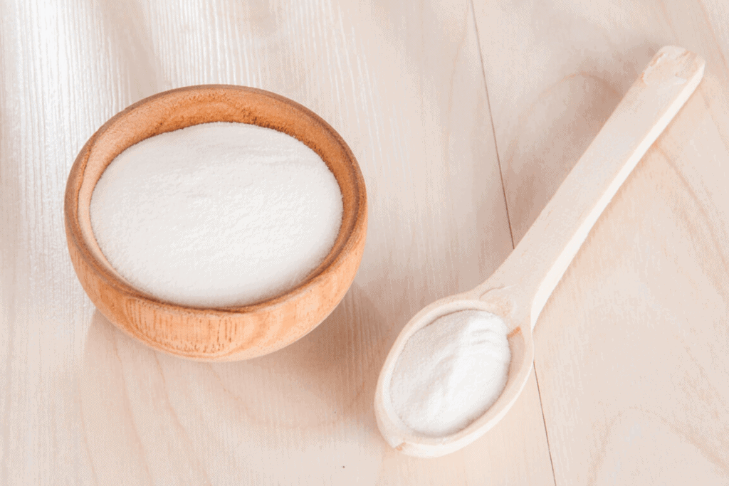 collagen in a wooden bowl and in a wooden spoon