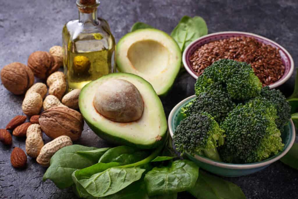 variety of nuts, flaxseeds, avocado and avocado oil, broccoli, and spinach