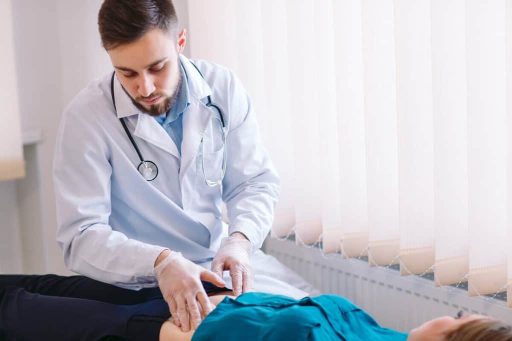 Image of doctor massaging patient