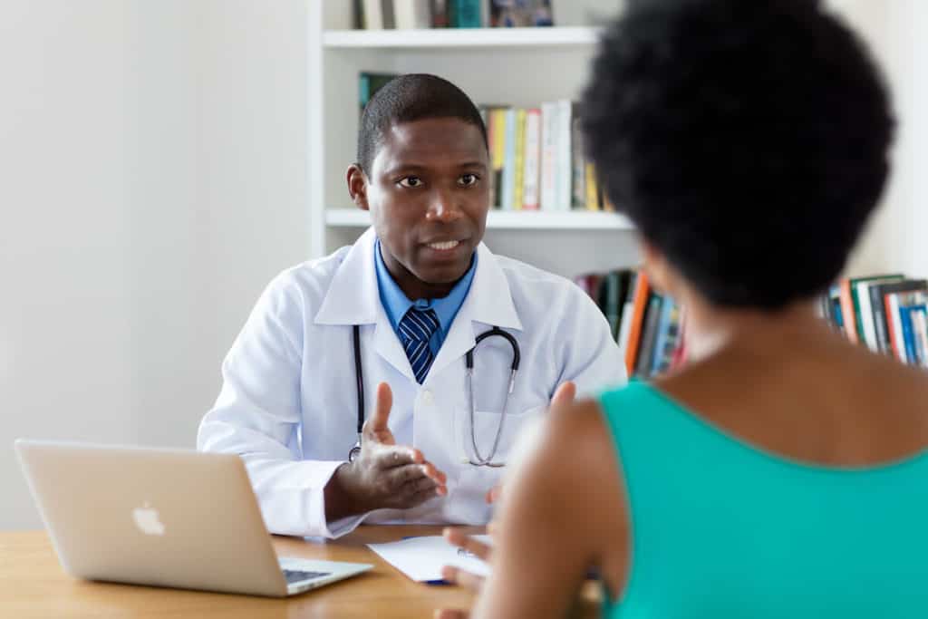 Doctor consulting with patient