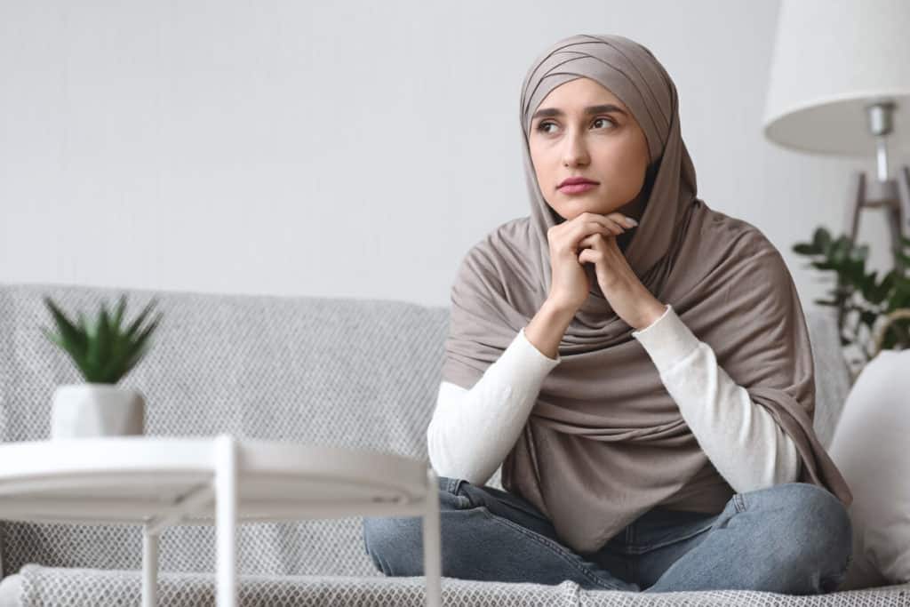 Woman seated in deep thought