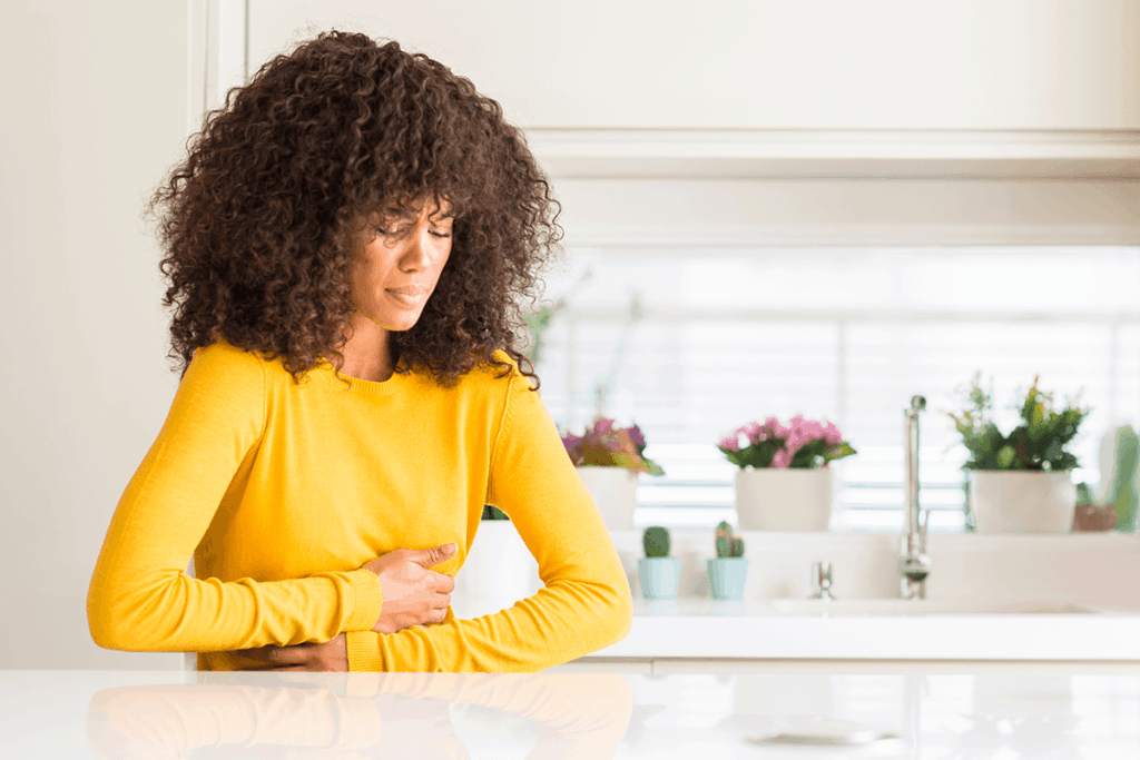 Woman holding stomach