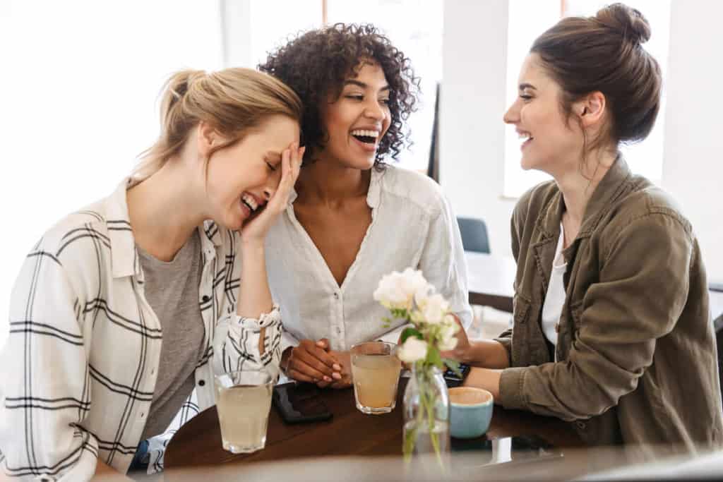 Three women laughing