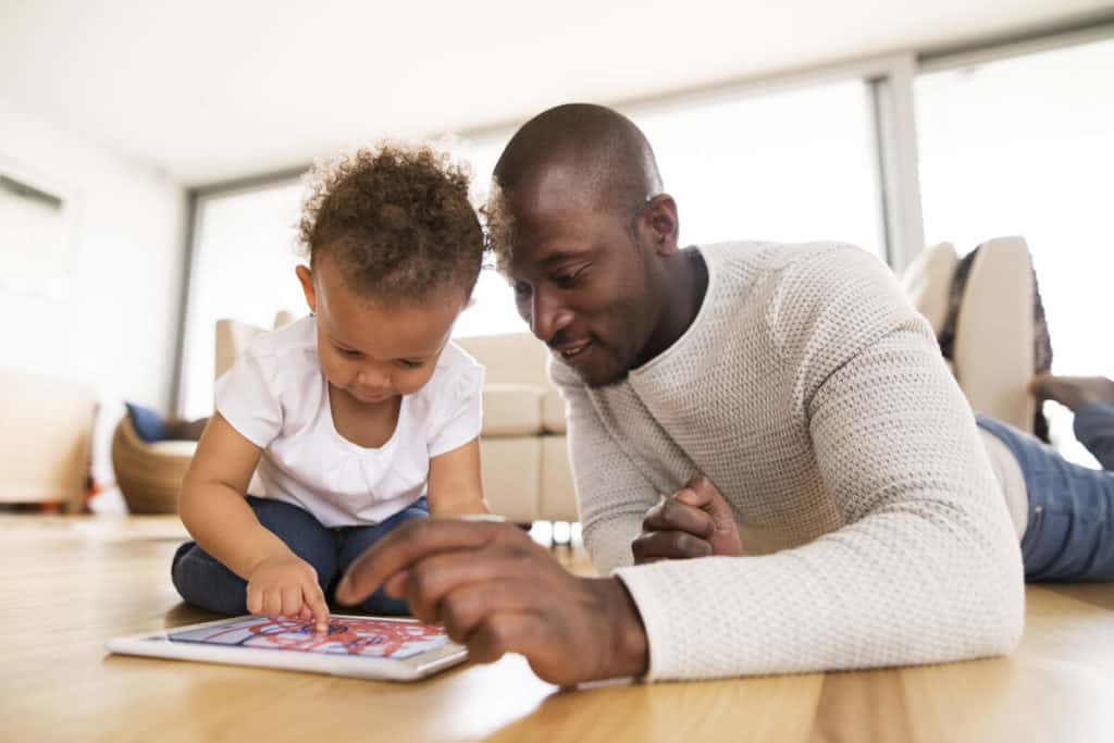 Man and child doing a puzzle