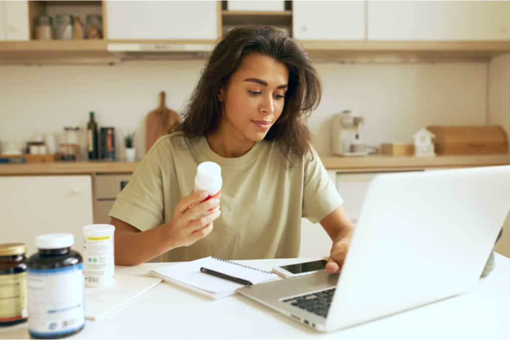 Woman holding a prescription bottle